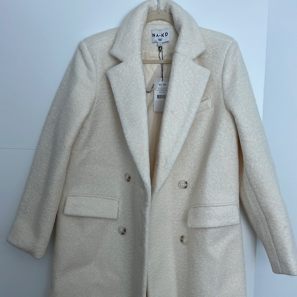 NA-KD long straight off white coat